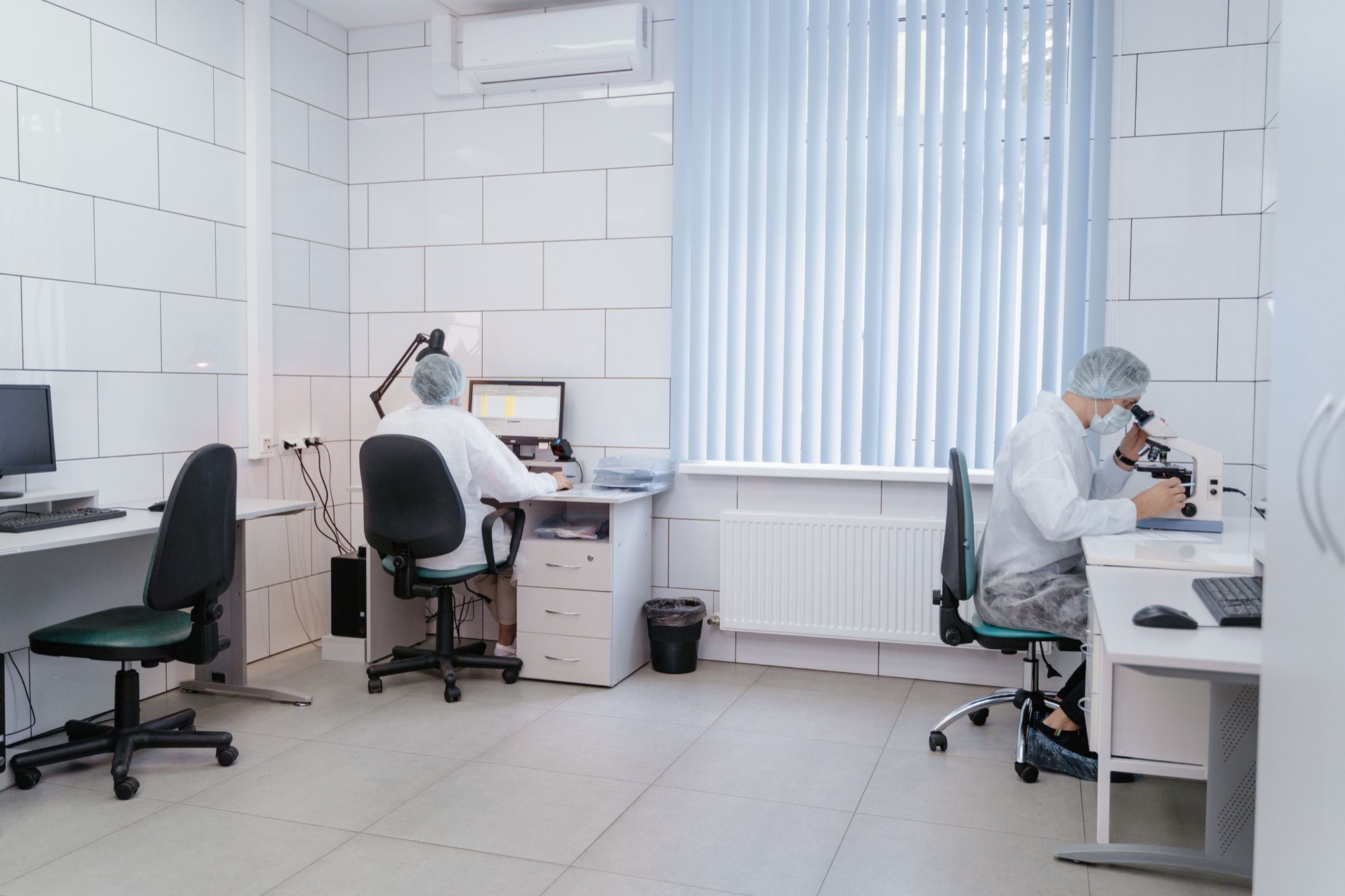 Analysts working at instruments in a laboratory