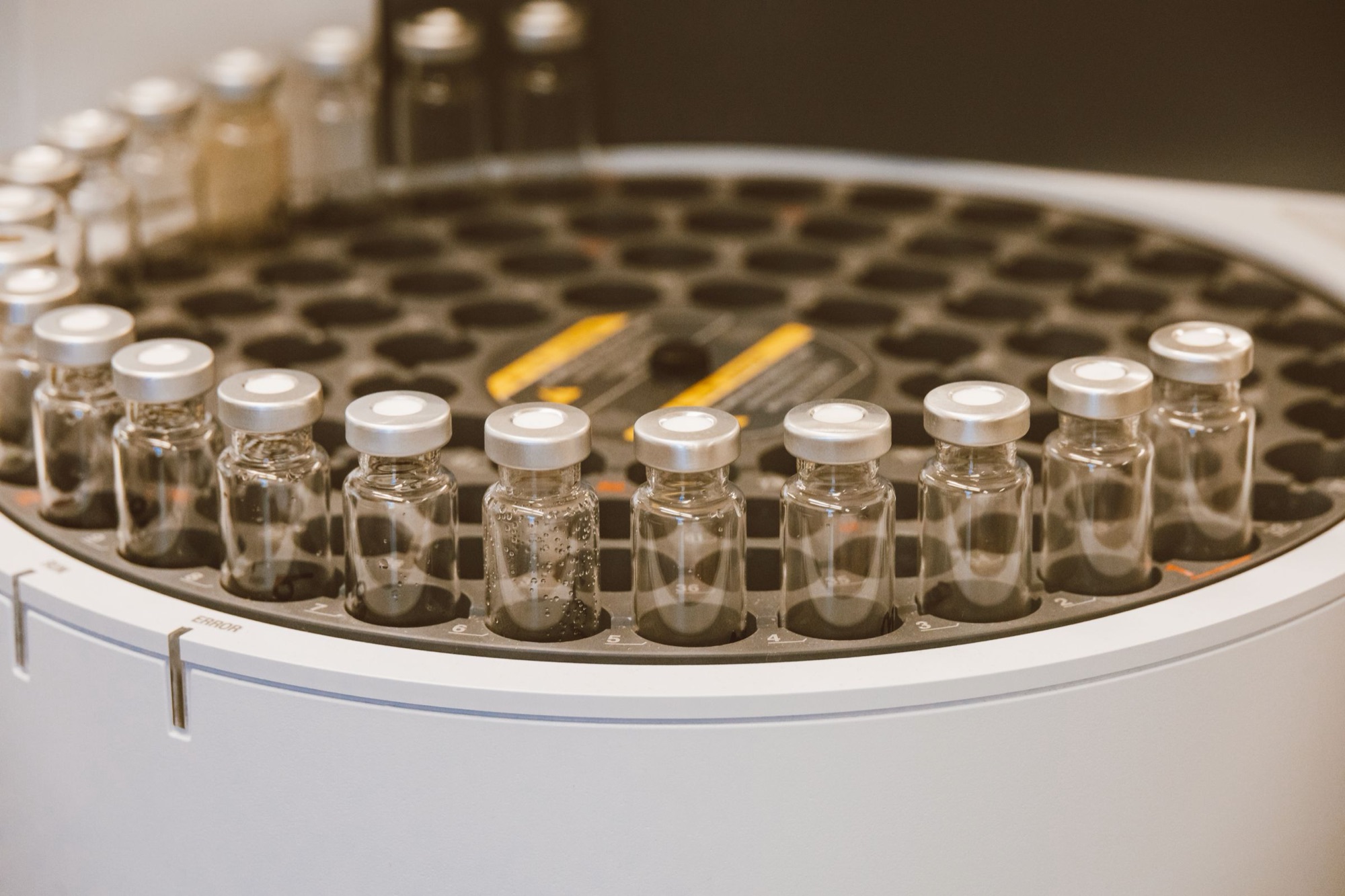 Glass sample vials arranged in an instrument carousel